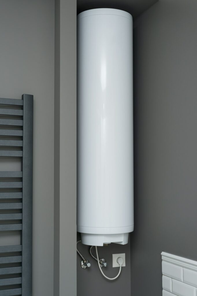 Electric water heater boiler in the bathroom interior. Interior details close-up